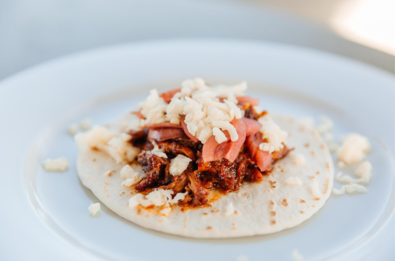 ORANGE GUAJILLO PULLED CHICKEN TACOS