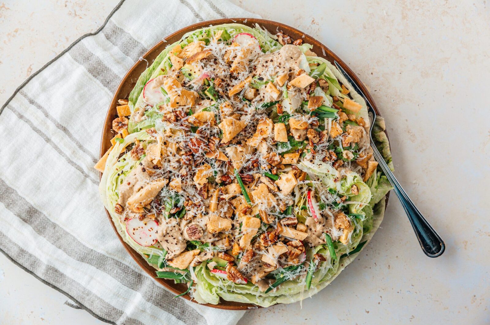 ICEBERG SALAD WITH EGGPLANT CREAM AND CRUNCHY HARISSA PECANS